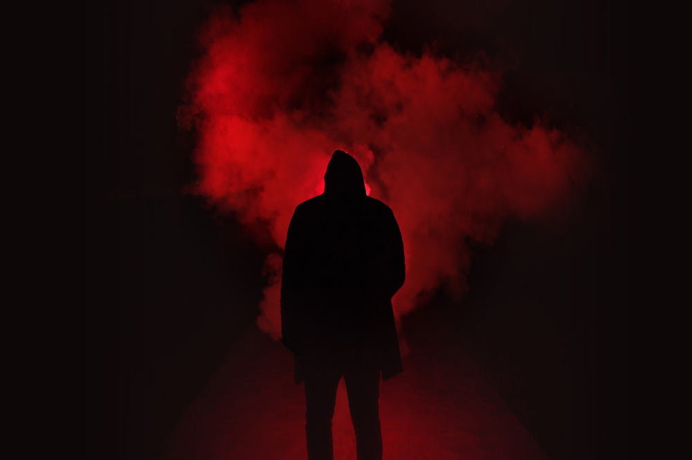 hooded-man-red-background.jpg